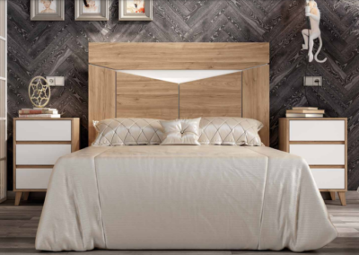 Dormitorio wall en color nogal combinado con blanco. Patas mesita inclinadas.